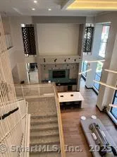 a kitchen with stainless steel appliances a stove a sink and a refrigerator