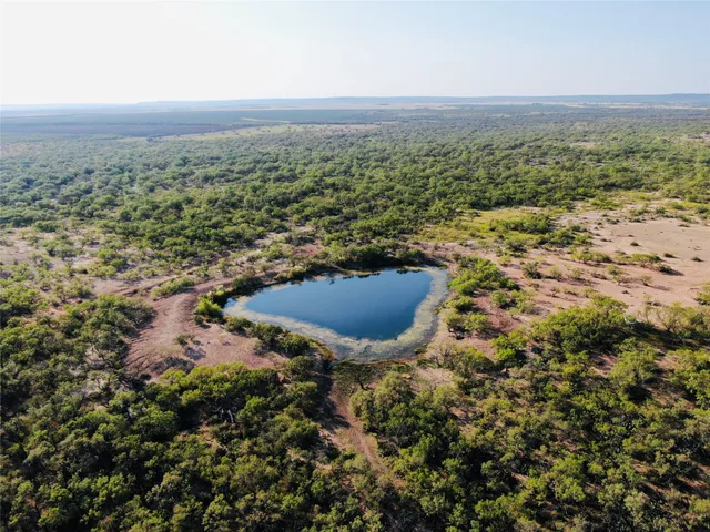a view of a lake and trees