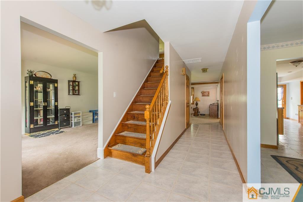 48 Roxy Avenue Edison, NJ 08820 - Photo 19 of 32 a view of a hallway with staircase
