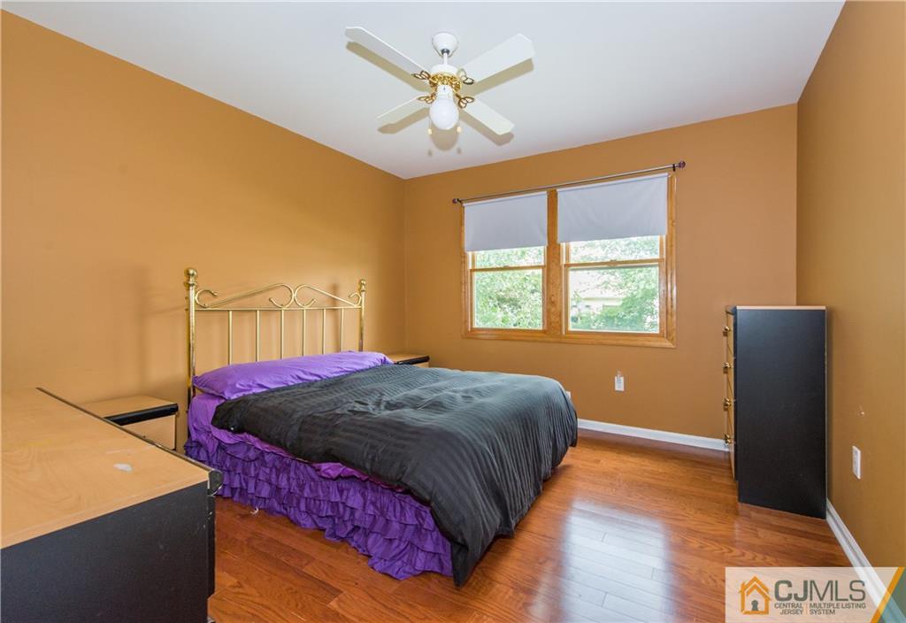 48 Roxy Avenue Edison, NJ 08820 - Photo 20 of 32 a bed sitting in a bedroom next to a window