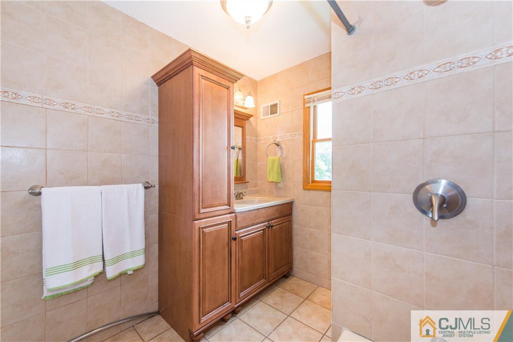 48 Roxy Avenue Edison, NJ 08820 - Photo 22 of 32 a bathroom with a shower and a sink