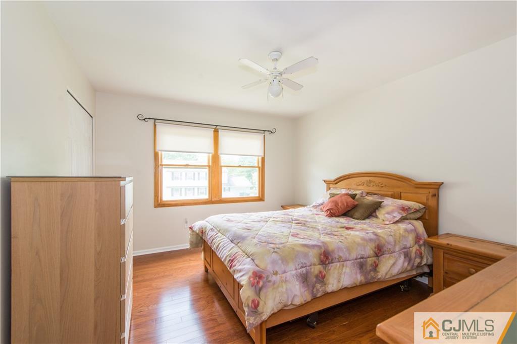 48 Roxy Avenue Edison, NJ 08820 - Photo 24 of 32 a bedroom with a bed and window
