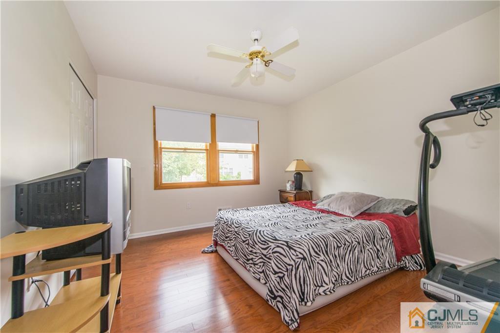 48 Roxy Avenue Edison, NJ 08820 - Photo 25 of 32 a bedroom with a bed window and a dresser