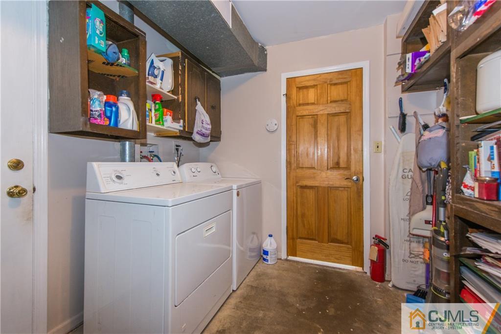 48 Roxy Avenue Edison, NJ 08820 - Photo 30 of 32 a utility room with dryer and washer