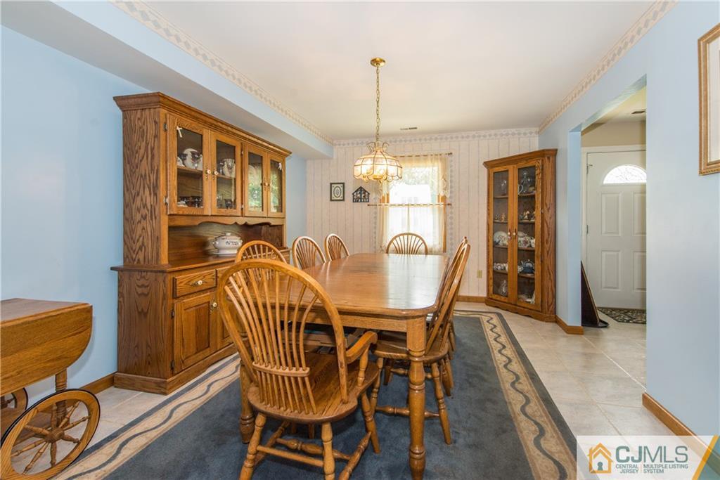 48 Roxy Avenue Edison, NJ 08820 - Photo 5 of 32 a dining room with furniture and window