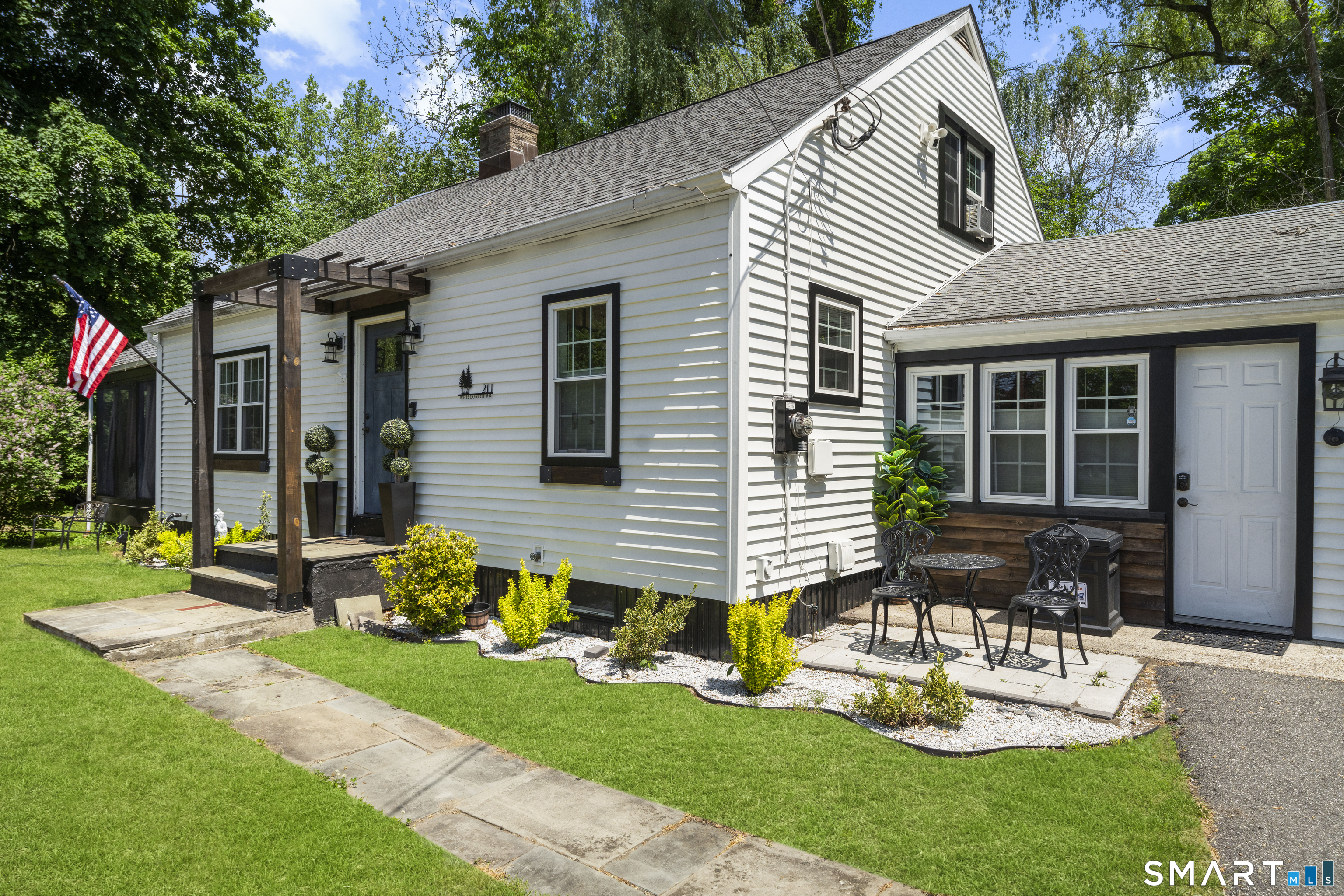 211 Whisconier Road Brookfield, CT 06804 - Photo 2 of 38 a front view of house with a garden and patio