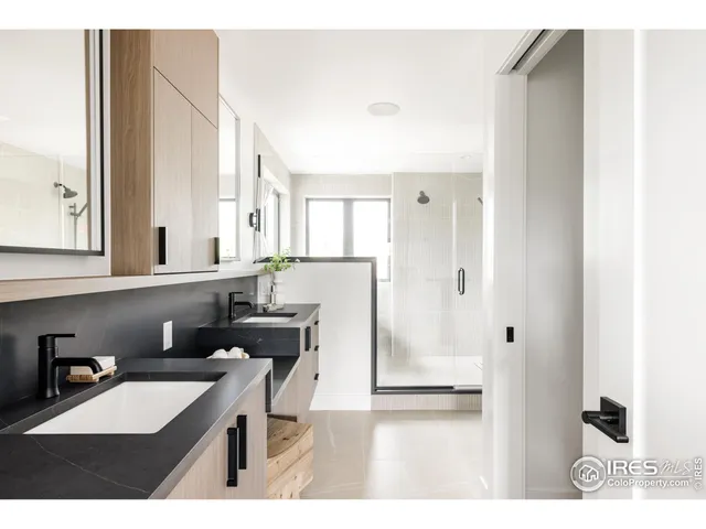 a kitchen with stainless steel appliances kitchen island granite countertop a stove a sink and a refrigerator with wooden floor