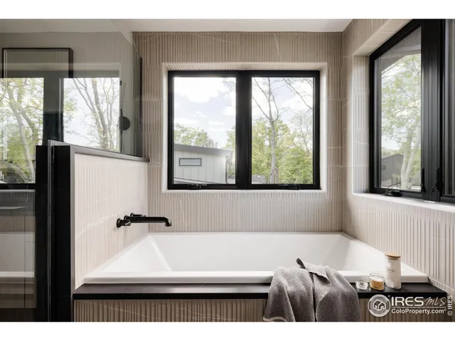 a bathroom with a sink vanity and mirror