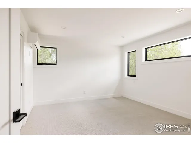 a bathroom with a toilet sink a mirror and vanity