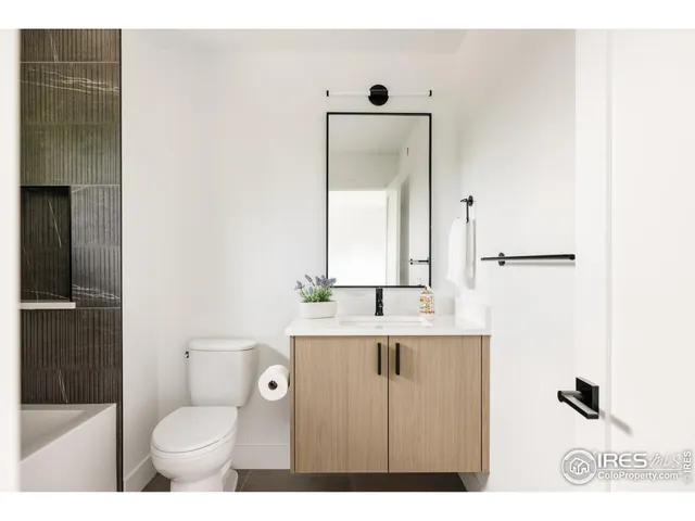 a white bath tub sitting in a bathroom
