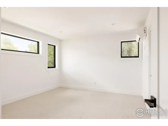 a bathroom with a granite countertop sink mirror and shower