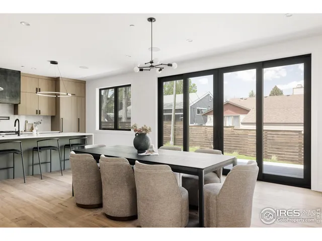 a room with furniture a large window and a chandelier