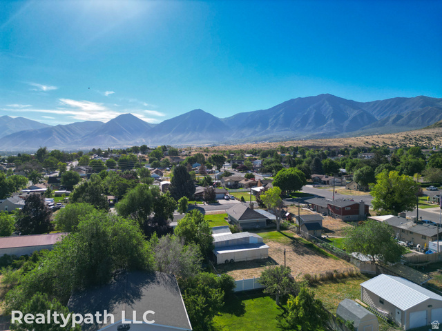 475 South 300 East Payson, UT 84651 - Photo 5 of 12 Expansive mountain backdrop with a residential neighborhood featuring numerous mature trees and a clear blue sky