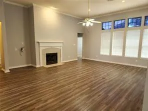wooden floor chandelier and windows in a room