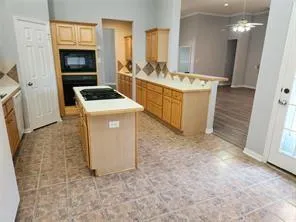 a kitchen with a stove and a refrigerator