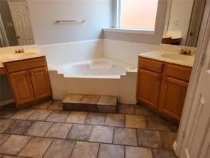 a bathroom with a sink and a bathtub