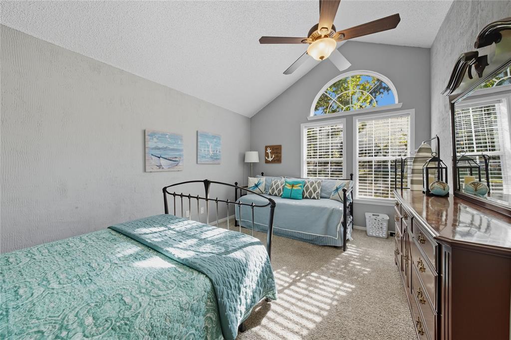 517 Shoreline Drive Tool, TX 75143 - Photo 14 of 28 a bedroom with furniture and a window