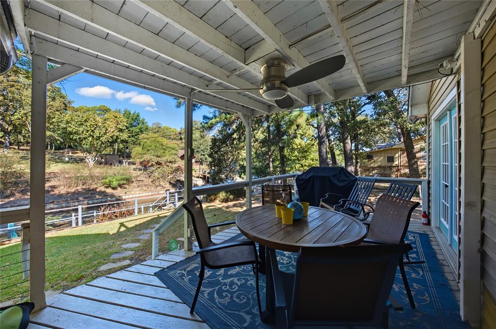 517 Shoreline Drive Tool, TX 75143 - Photo 22 of 28 a outdoor dining space with furniture and garden view