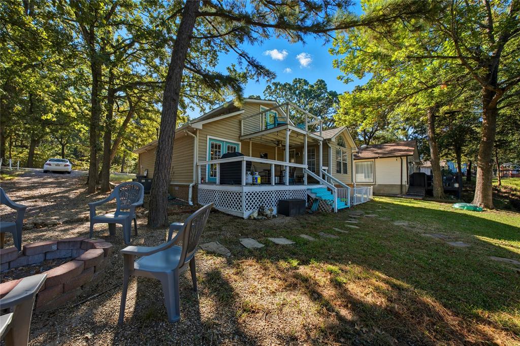 517 Shoreline Drive Tool, TX 75143 - Photo 26 of 28 a view of a house with backyard and sitting area