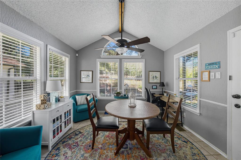 517 Shoreline Drive Tool, TX 75143 - Photo 10 of 28 a dining room with furniture a chandelier and window