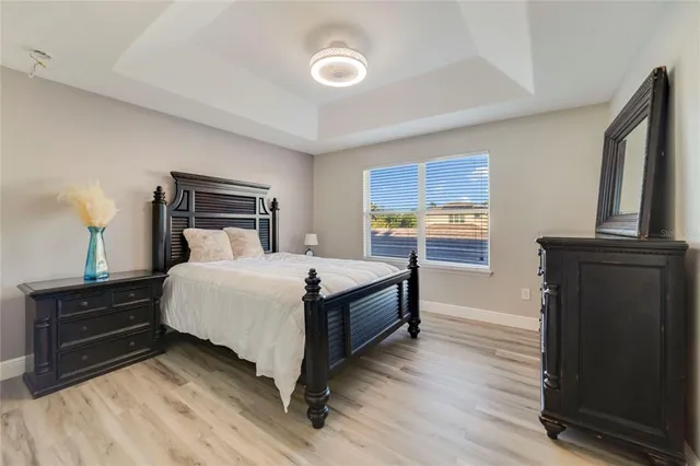 a bedroom with a bed and a dresser