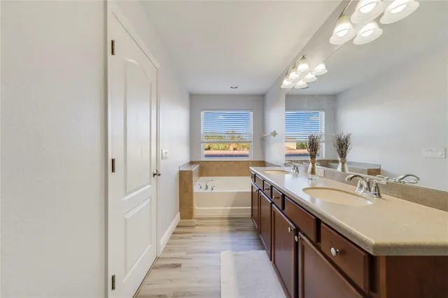 a kitchen with stainless steel appliances a sink stove and cabinets