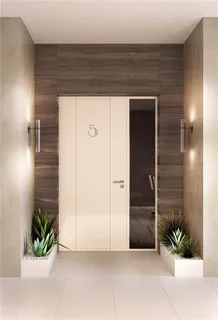 a view of front door and potted plants