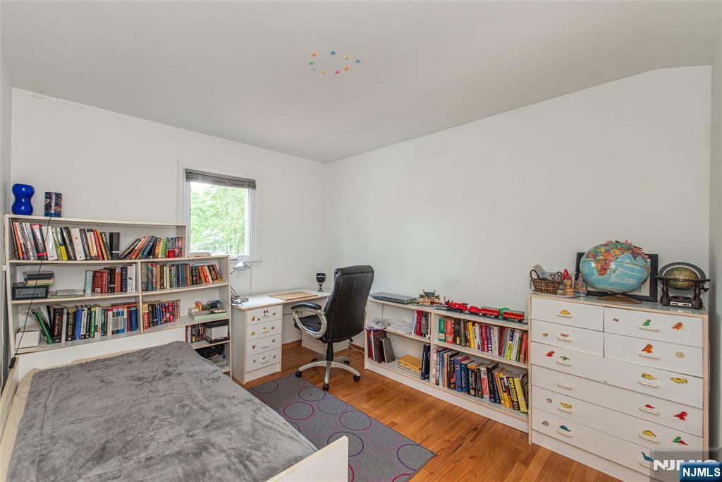 12 Abbott Road Wayne, NJ 07470 - Photo 34 of 49 a view of a workspace with furniture and a book shelf