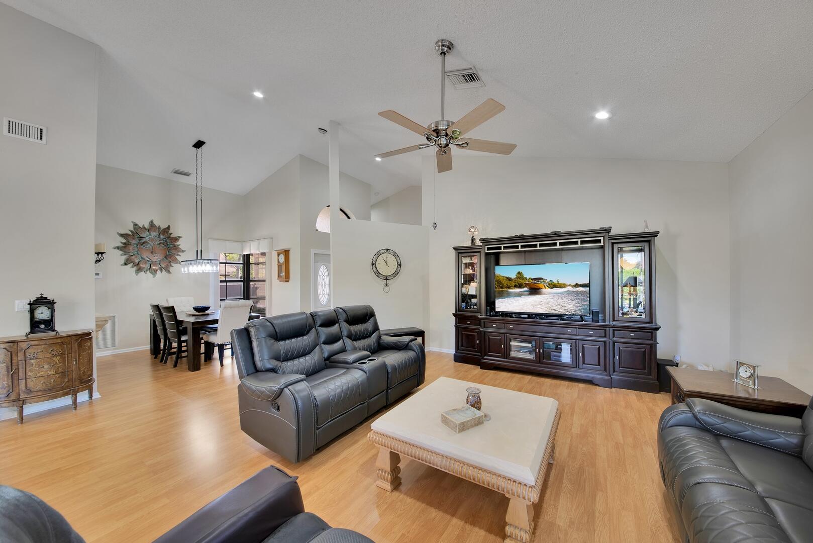 19261 Cherry Hills Terrace Boca Raton, FL 33498 - Photo 10 of 53 a living room with furniture and a flat screen tv