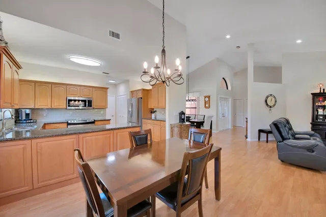 a kitchen with lots of counter top space and dining table