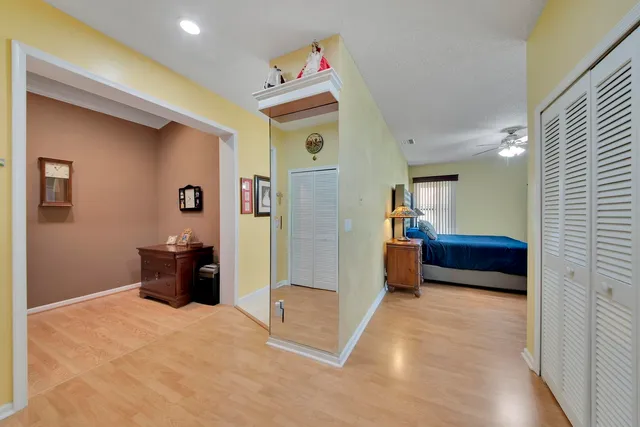 a large kitchen with a table and chairs