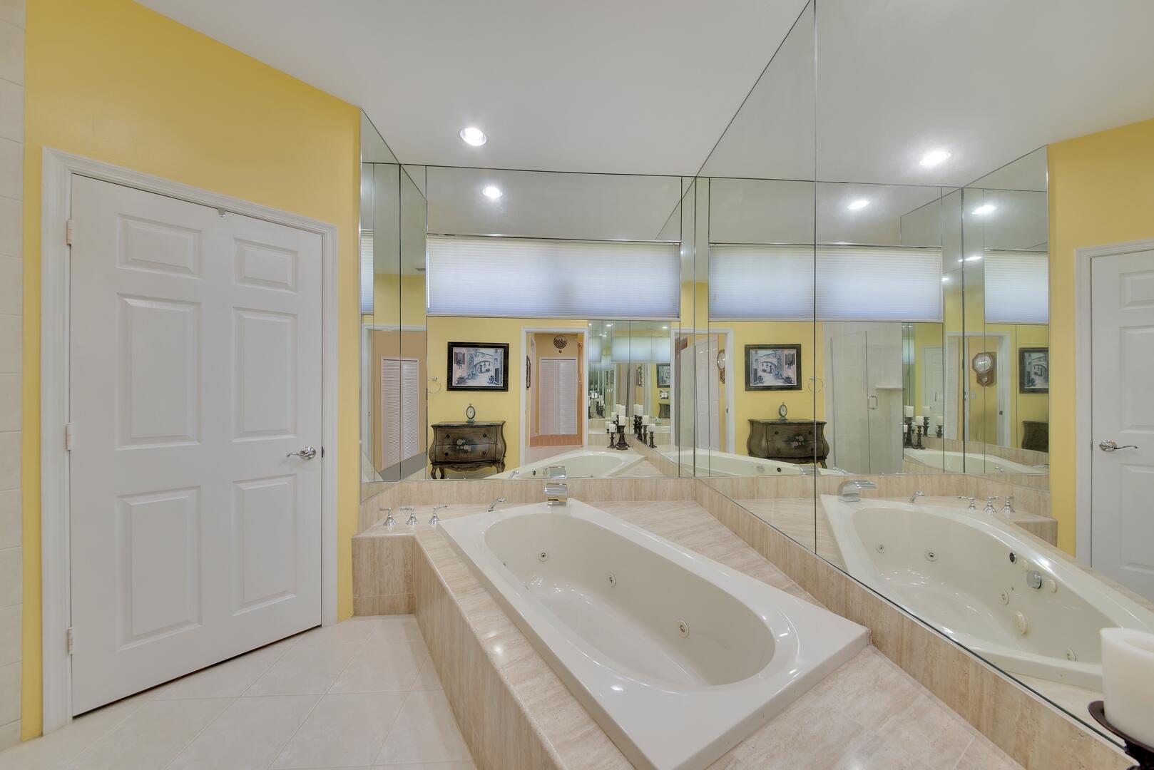 19261 Cherry Hills Terrace Boca Raton, FL 33498 - Photo 23 of 53 a bathroom with a granite countertop sink a bathtub and shower