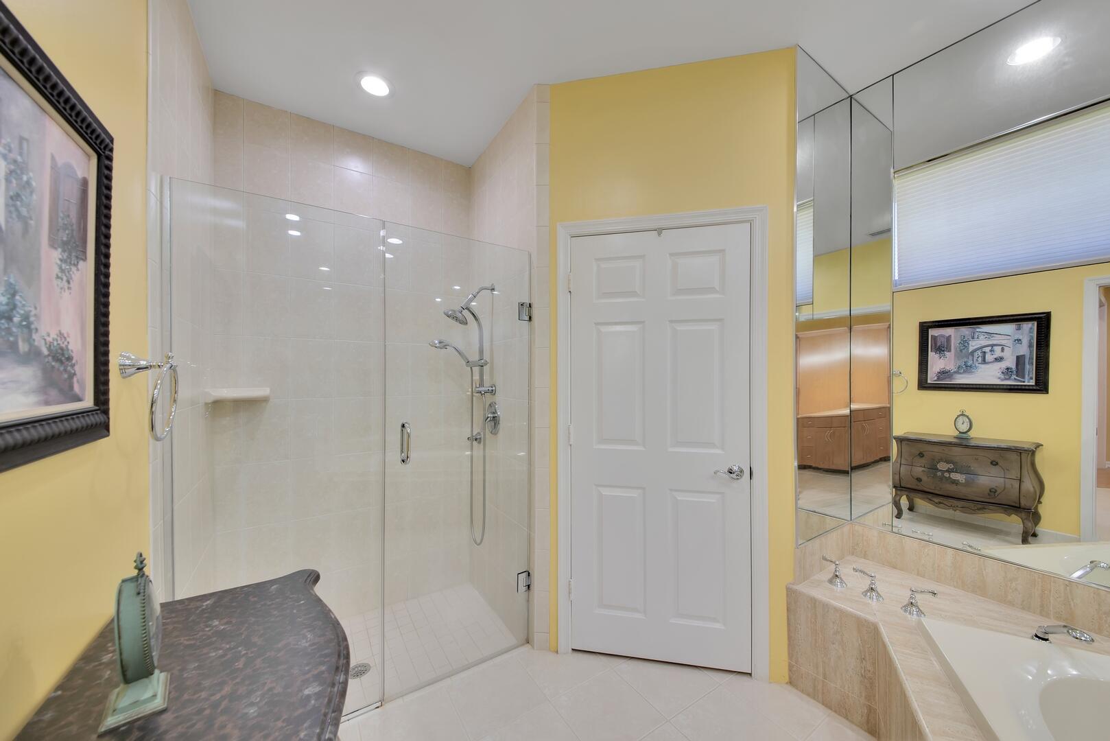 19261 Cherry Hills Terrace Boca Raton, FL 33498 - Photo 24 of 53 a bathroom with a tub shower and sink