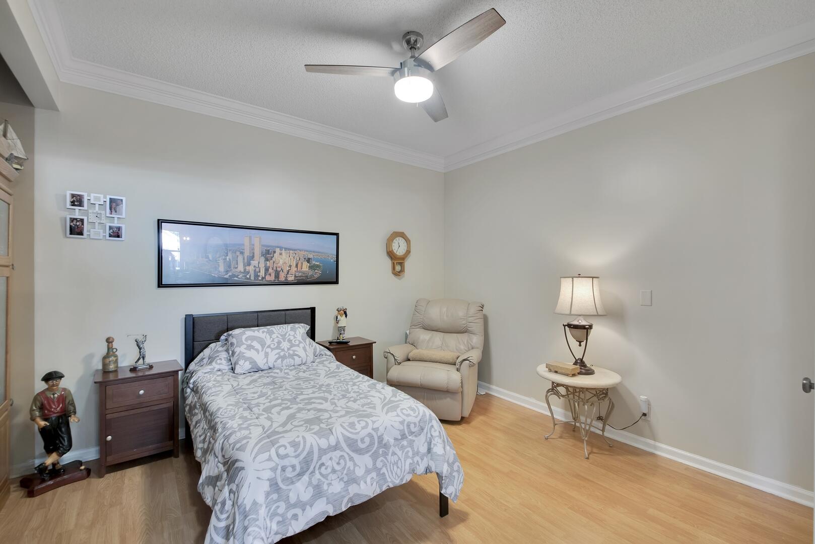 19261 Cherry Hills Terrace Boca Raton, FL 33498 - Photo 26 of 53 a bedroom with a bed and a lamp on table