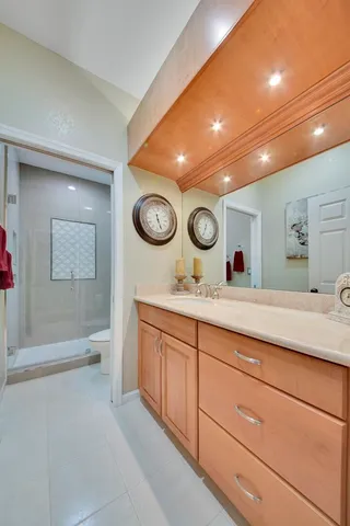 a bedroom with a bed and a lamp on table