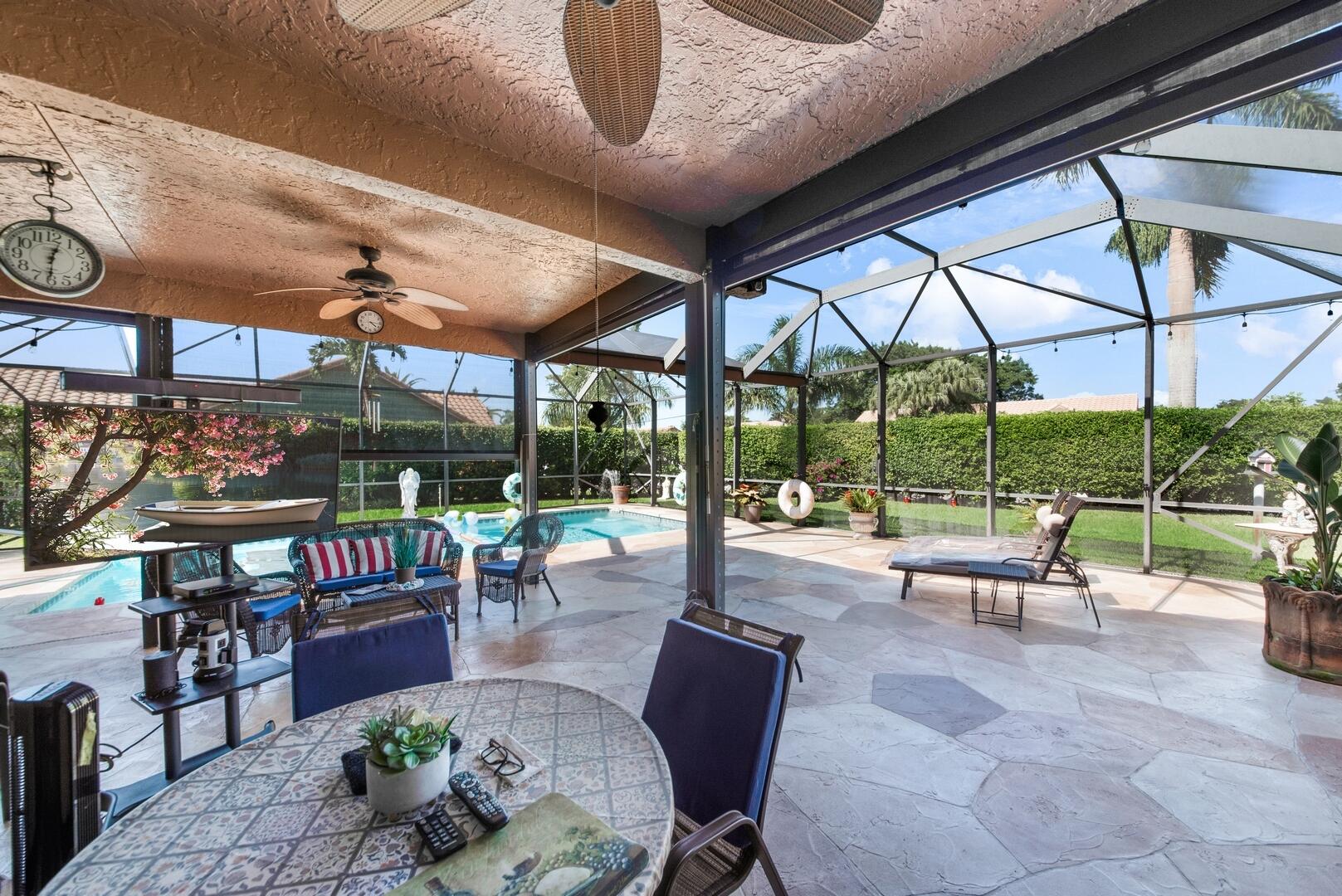 19261 Cherry Hills Terrace Boca Raton, FL 33498 - Photo 31 of 53 a building outdoor space with patio furniture and potted plants