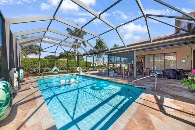 a view of a swimming pool with a patio