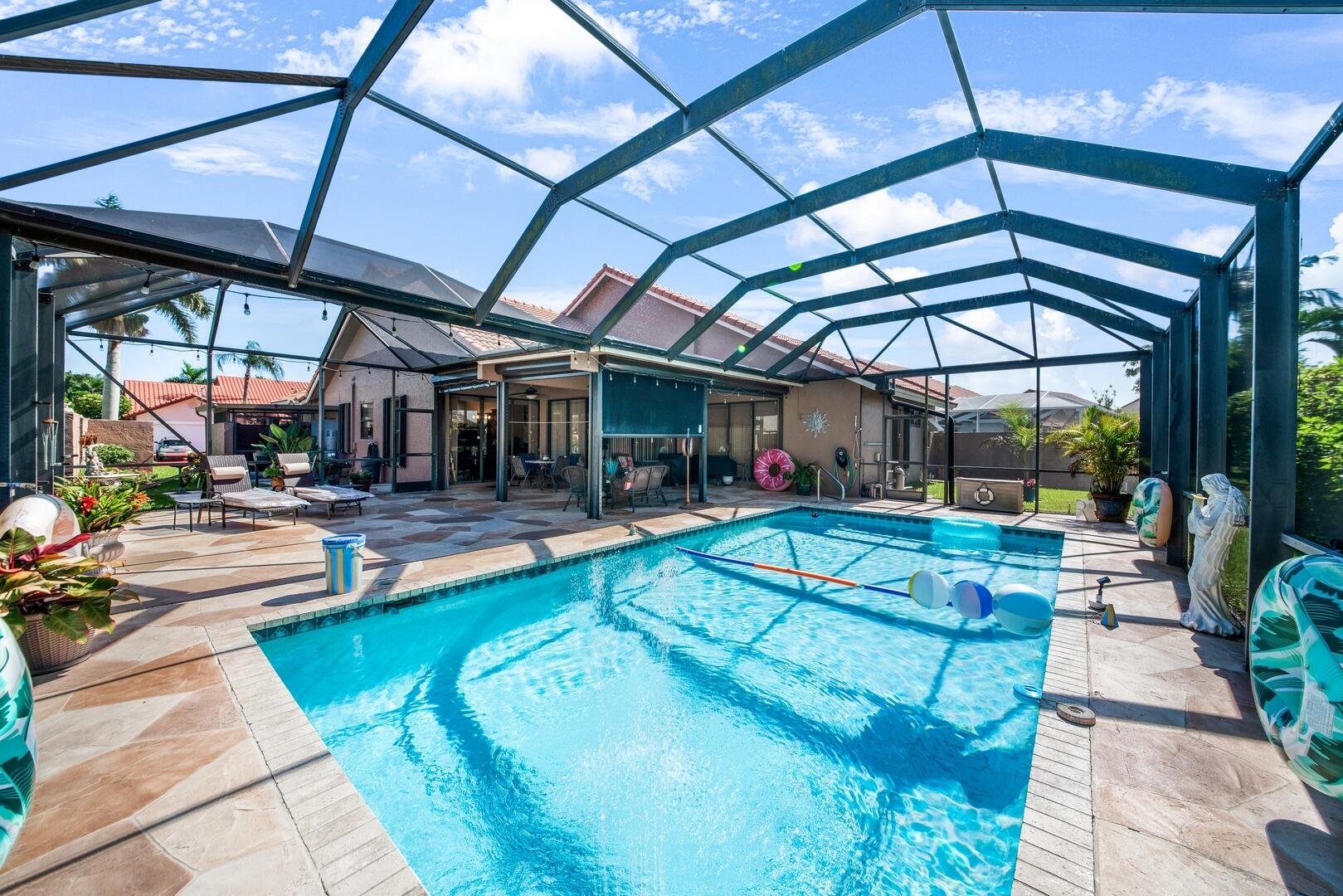 19261 Cherry Hills Terrace Boca Raton, FL 33498 - Photo 35 of 53 a view of a swimming pool with a patio