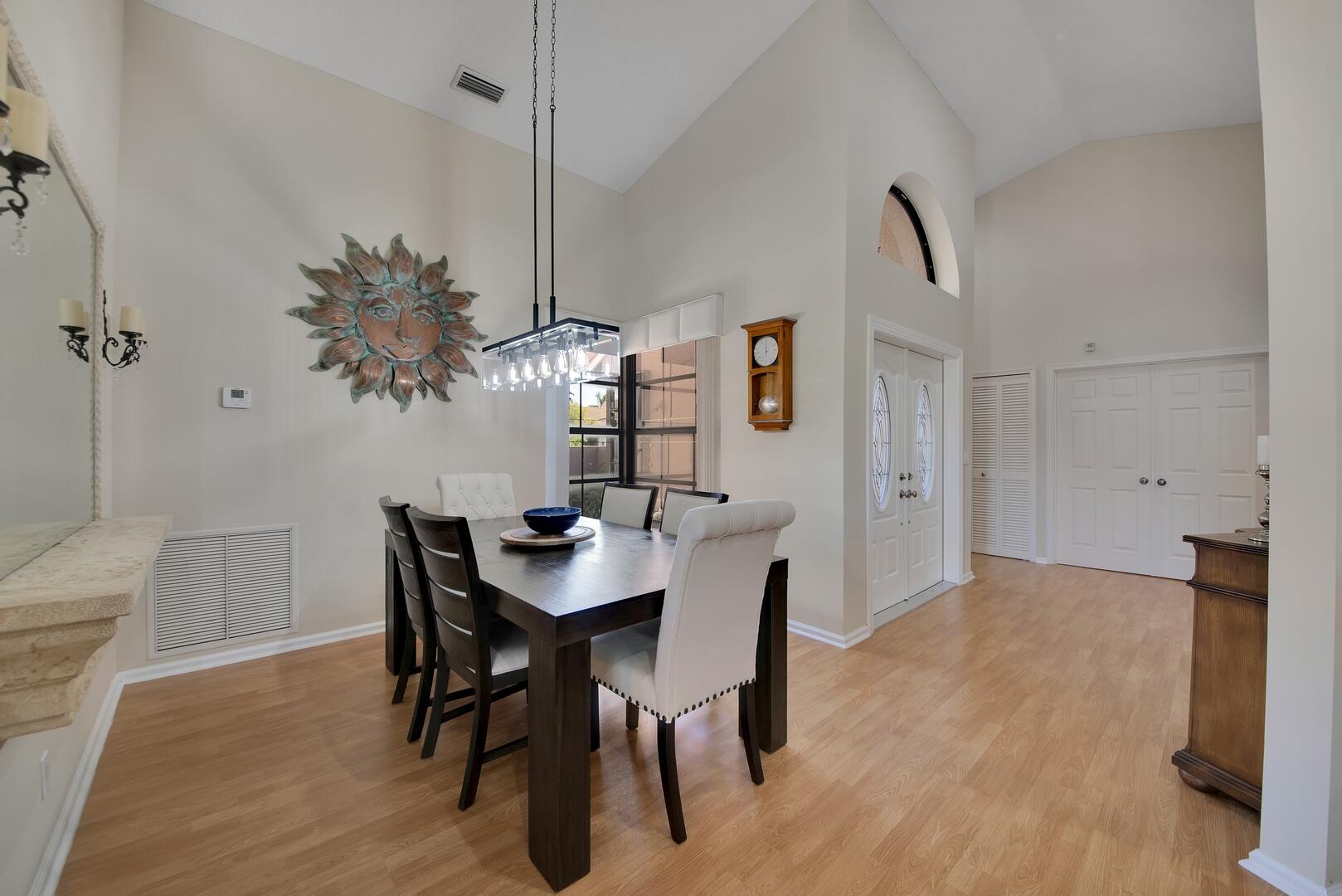 19261 Cherry Hills Terrace Boca Raton, FL 33498 - Photo 4 of 53 a view of a dining room with furniture and wooden floor