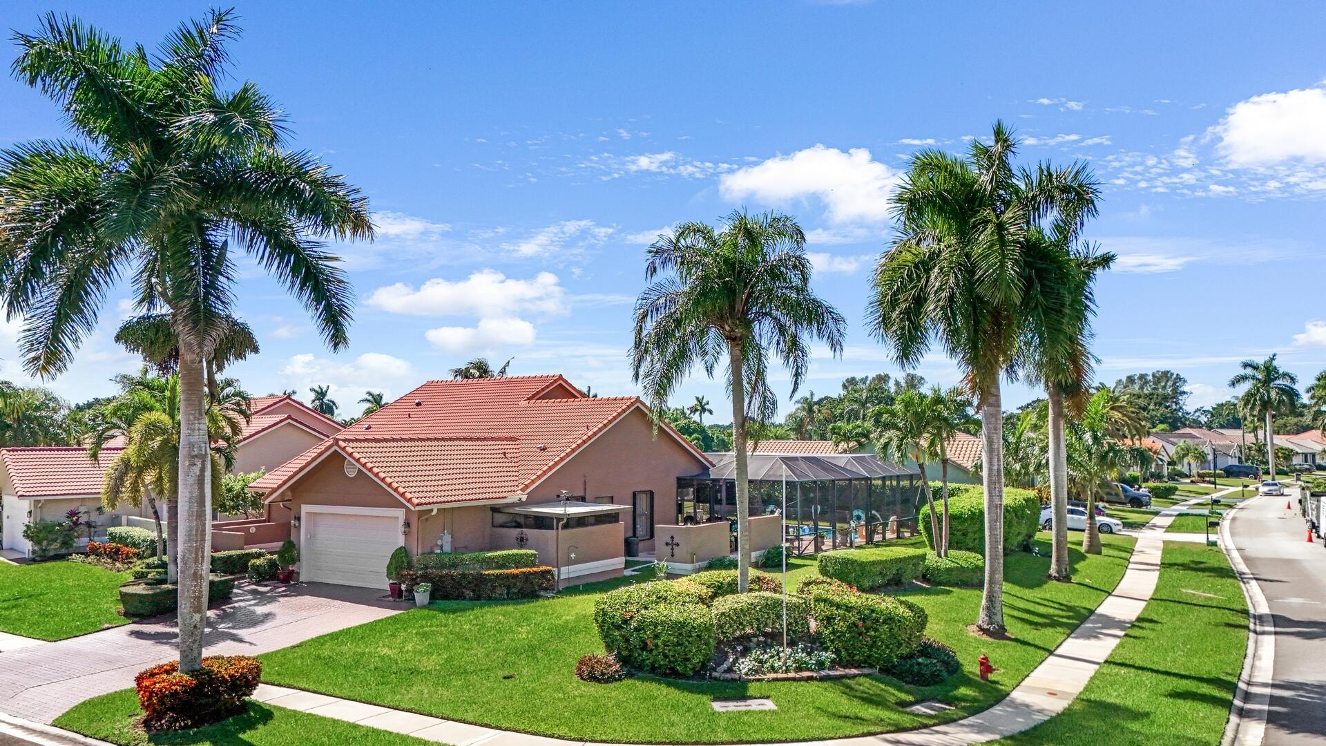 19261 Cherry Hills Terrace Boca Raton, FL 33498 - Photo 41 of 53 a front view of a house with garden