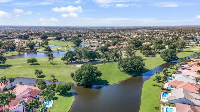 an aerial view of a city with lots of residential buildings lake and ocean view