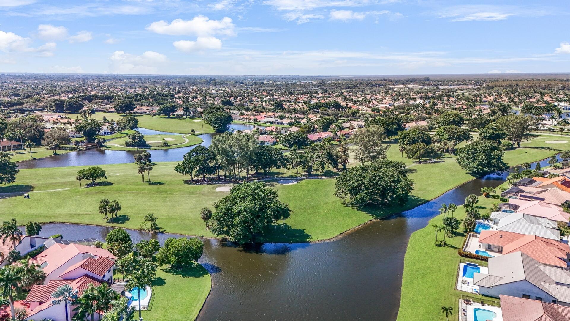 19261 Cherry Hills Terrace Boca Raton, FL 33498 - Photo 48 of 53 an aerial view of a city with lots of residential buildings lake and ocean view