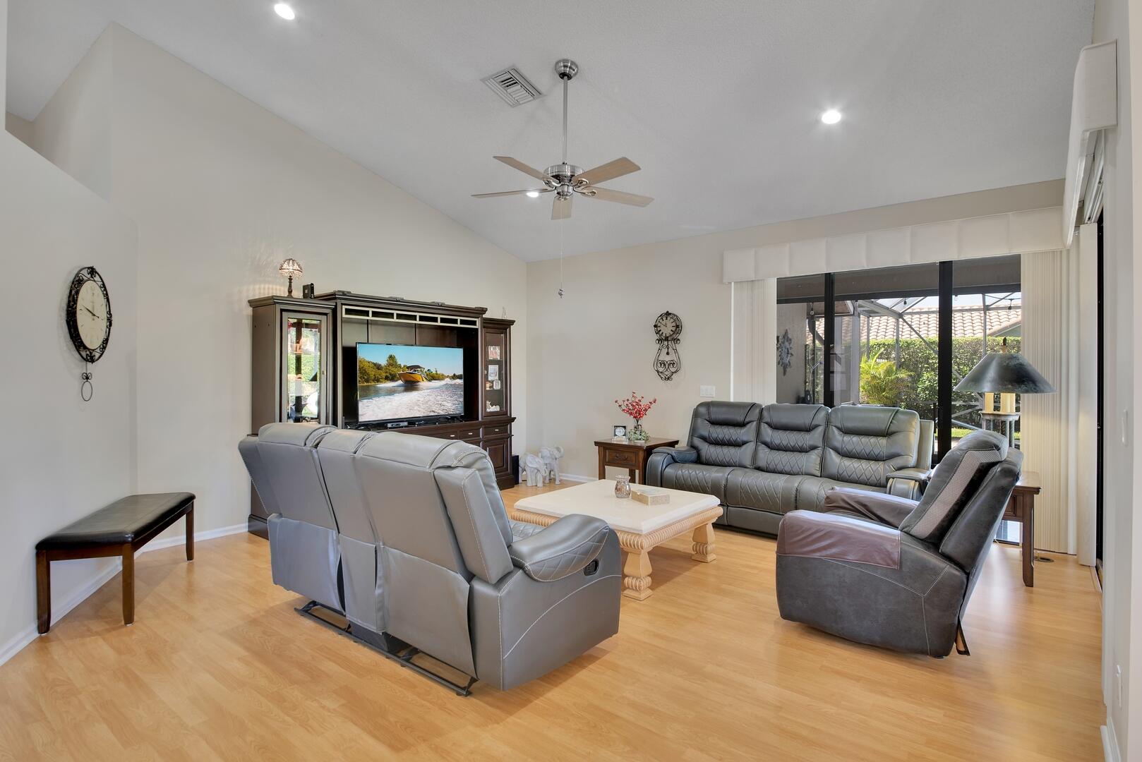 19261 Cherry Hills Terrace Boca Raton, FL 33498 - Photo 7 of 53 a living room with furniture and a large window