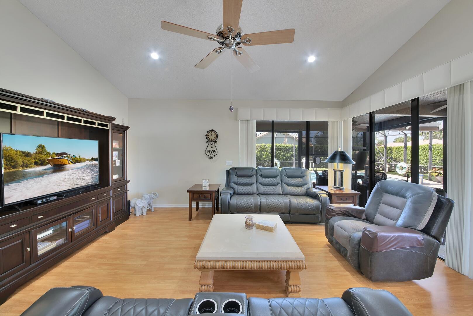 19261 Cherry Hills Terrace Boca Raton, FL 33498 - Photo 8 of 53 a living room with furniture and a flat screen tv