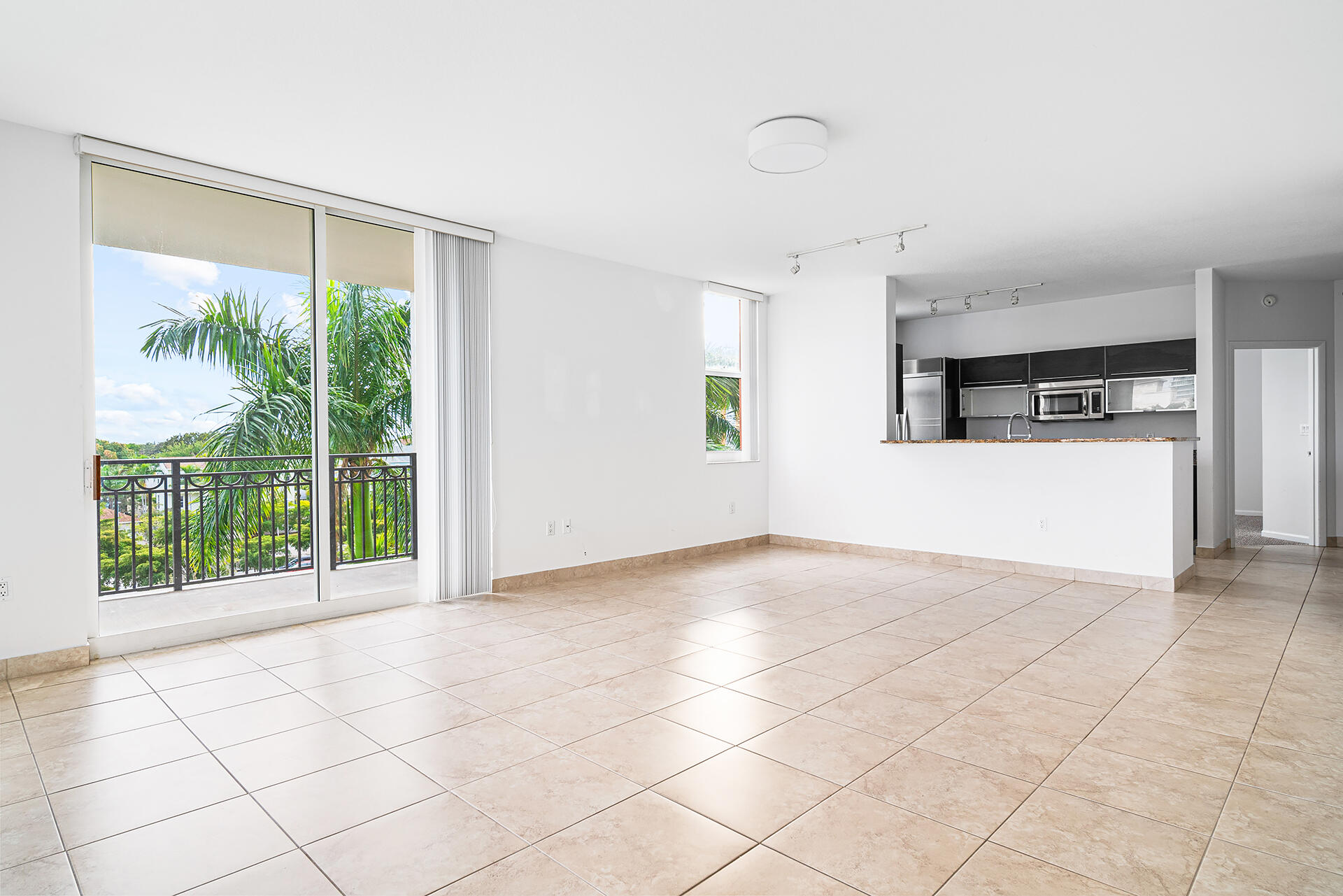 a view of a kitchen with a sink and a window