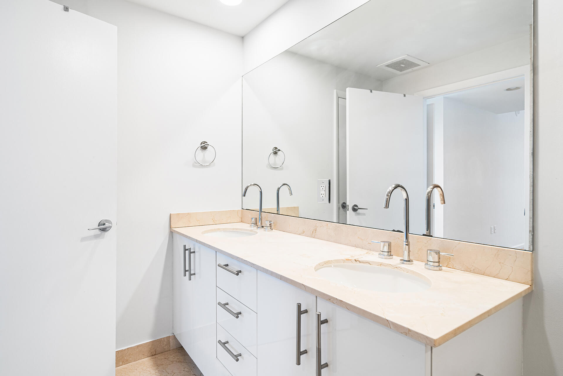 550 Okeechobee Boulevard, Unit 428 West Palm Beach, FL 33401 - Photo 11 of 29 a bathroom with a sink and a mirror