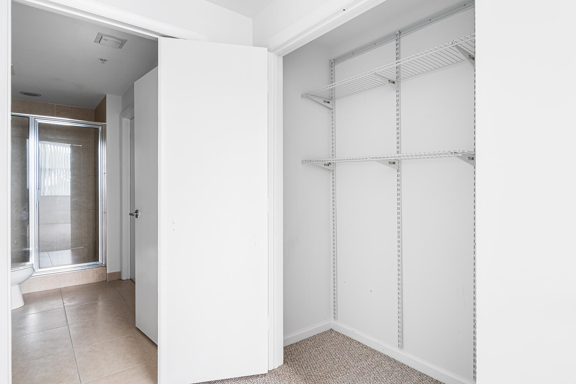 550 Okeechobee Boulevard, Unit 428 West Palm Beach, FL 33401 - Photo 16 of 29 a view of a closet area with empty room