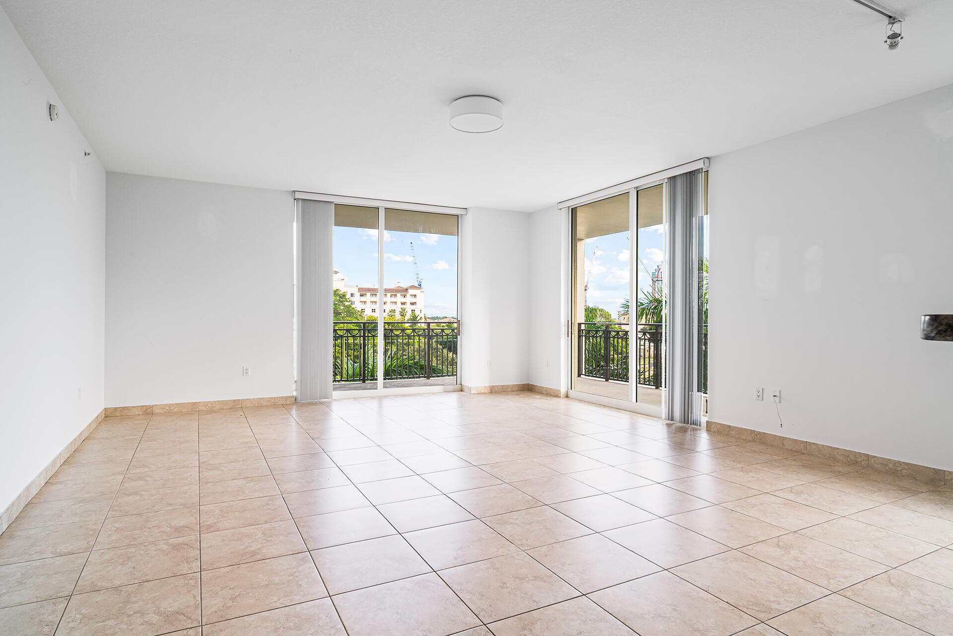 550 Okeechobee Boulevard, Unit 428 West Palm Beach, FL 33401 - Photo 2 of 29 a view of an empty room with a window