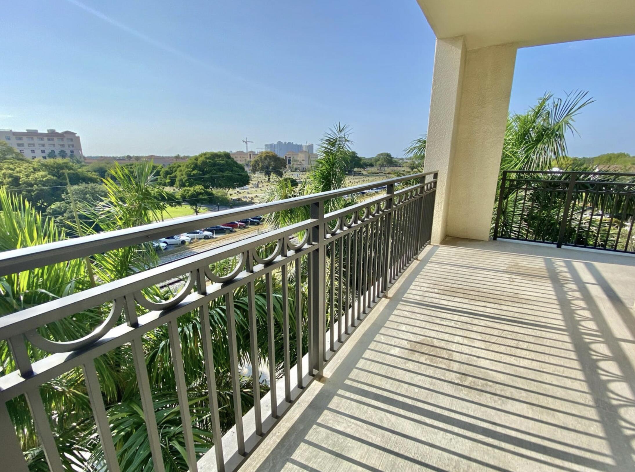 550 Okeechobee Boulevard, Unit 428 West Palm Beach, FL 33401 - Photo 26 of 29 a view of balcony with wooden floor and fence