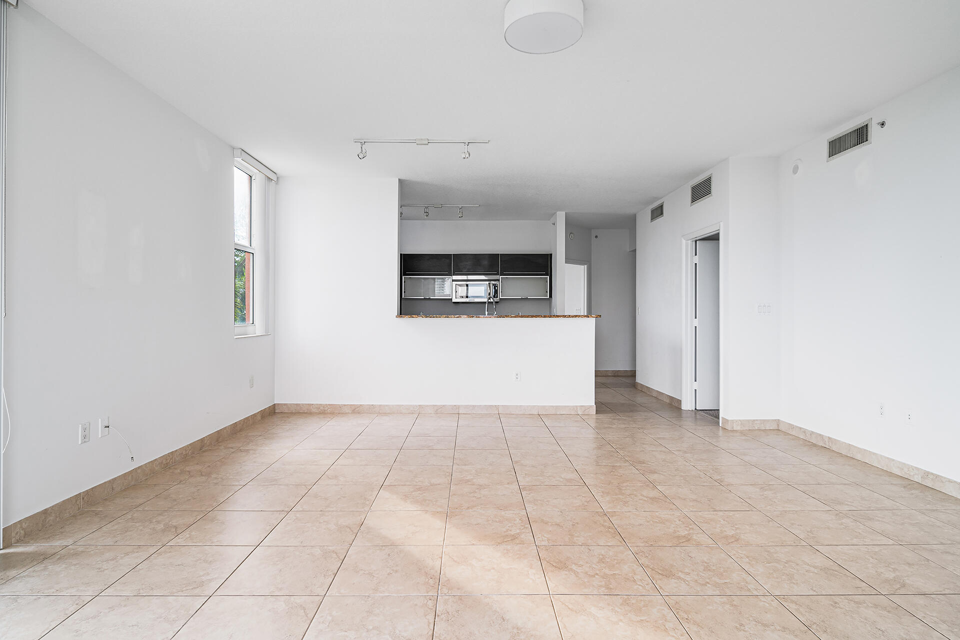 550 Okeechobee Boulevard, Unit 428 West Palm Beach, FL 33401 - Photo 4 of 29 a view of a hallway to rooms